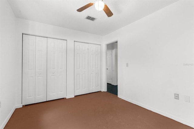 10221 Elgin Blvd, Spring Hill, FL 34608 - unfurnished bedroom with two closets and ceiling fan