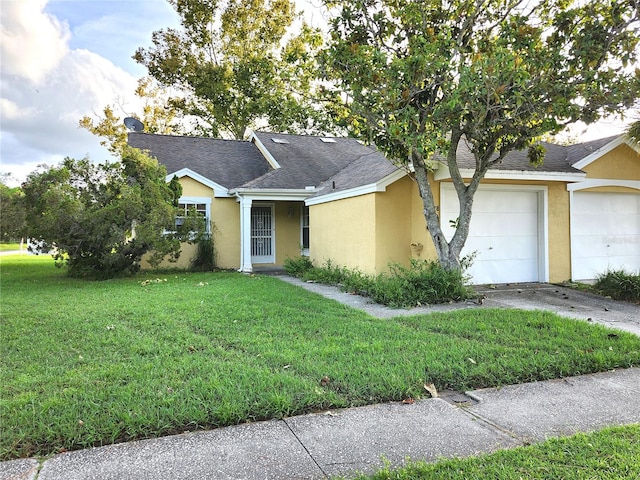 ranch-style house with a garage and a front lawn