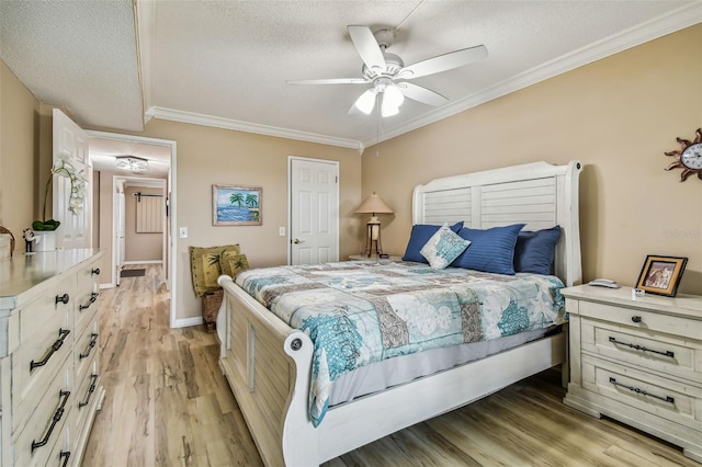 bedroom with a textured ceiling, light wood-type flooring, and ceiling fan