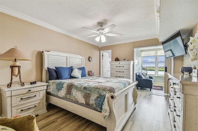 bedroom with ceiling fan, a textured ceiling, light hardwood / wood-style flooring, and crown molding