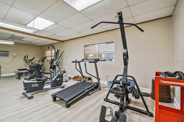 1847 Shore Dr S Unit 614, South Pasadena, FL 33707 - gym featuring wood finished floors, a drop ceiling, baseboards, and a wall unit AC