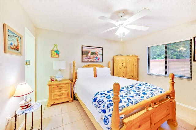 tiled bedroom with ceiling fan