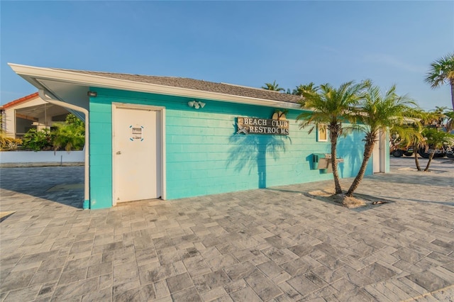 exterior space featuring concrete block siding