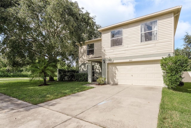 view of front of property with a garage and a front yard