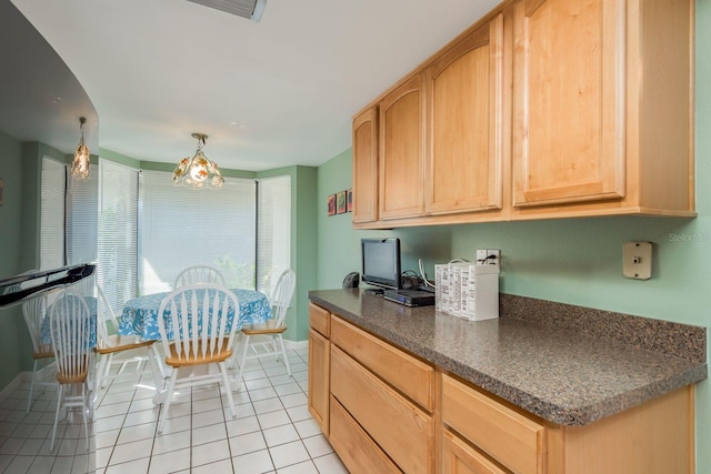 kitchen featuring light brown cabinetry and light tile patterned flooring