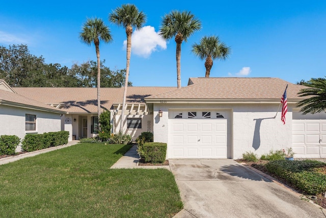 ranch-style house with a front yard and a garage