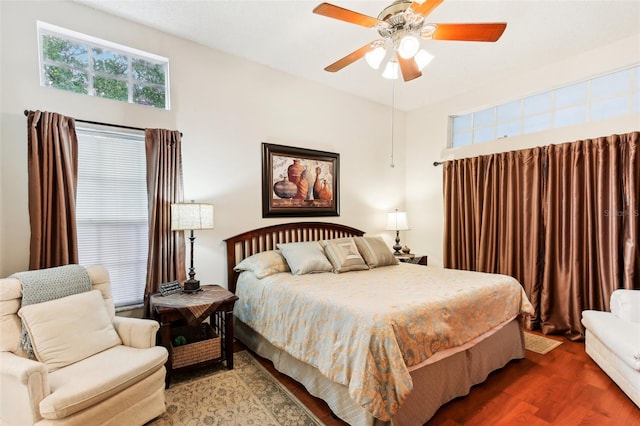 bedroom with hardwood / wood-style floors and ceiling fan