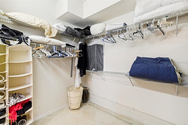 spacious closet featuring tile patterned floors