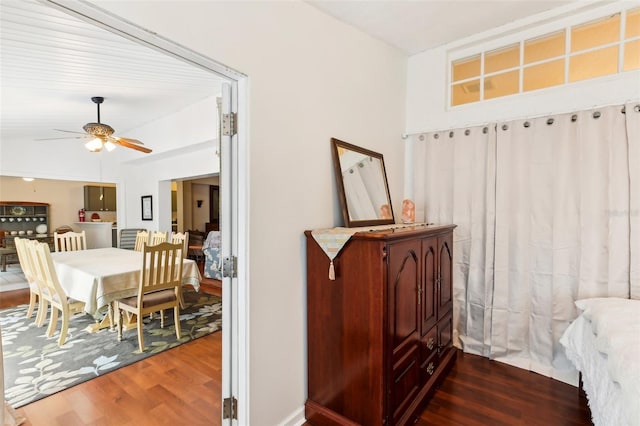 interior space with ceiling fan and dark wood-type flooring