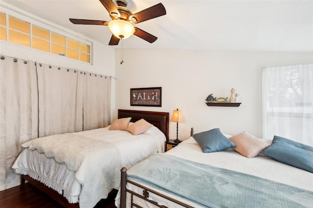 bedroom featuring vaulted ceiling, ceiling fan, and hardwood / wood-style floors