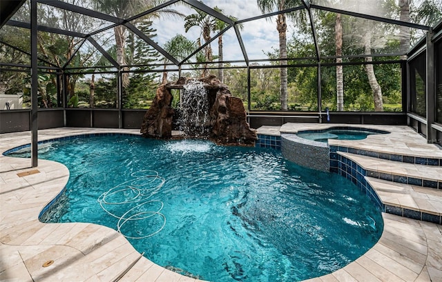 view of pool with an in ground hot tub, pool water feature, and a lanai