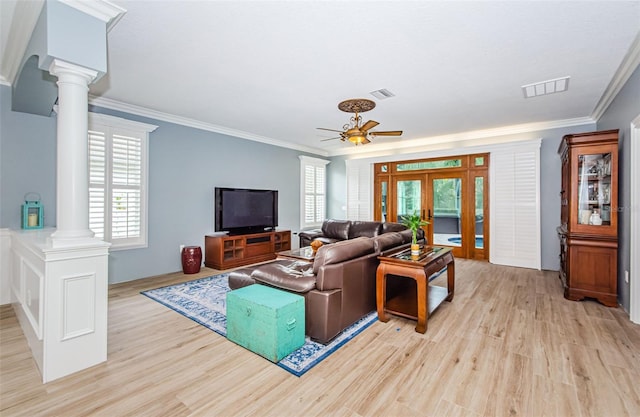 living room with light hardwood / wood-style flooring, ceiling fan, crown molding, and a wealth of natural light