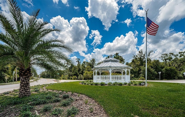 view of home's community with a gazebo and a yard