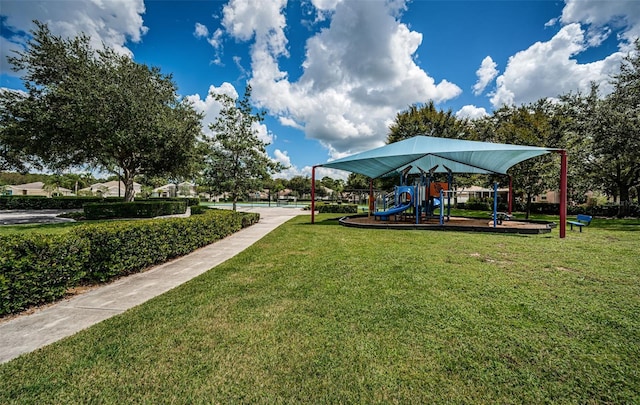 view of community with a yard and a playground