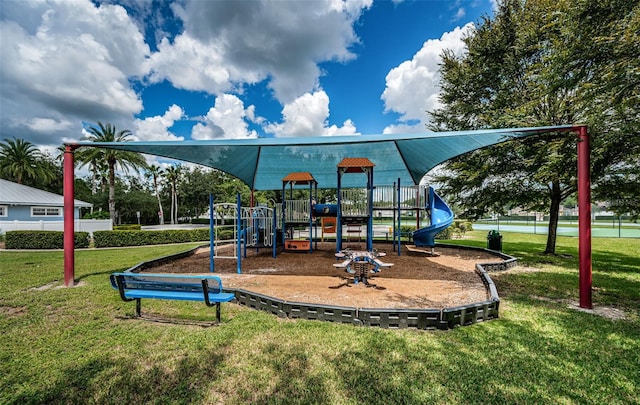 view of jungle gym featuring a lawn