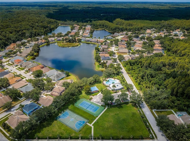 birds eye view of property with a water view