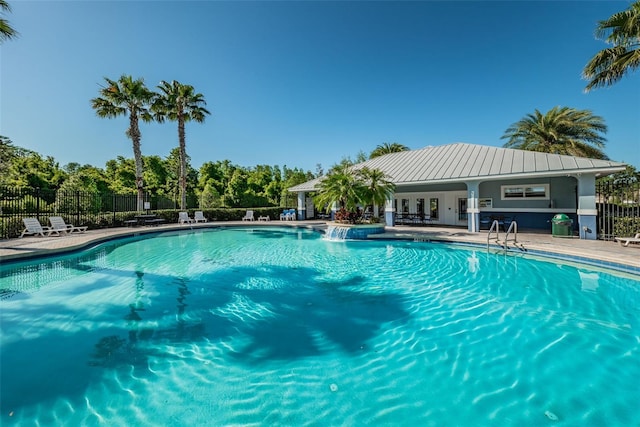 view of swimming pool with a patio area