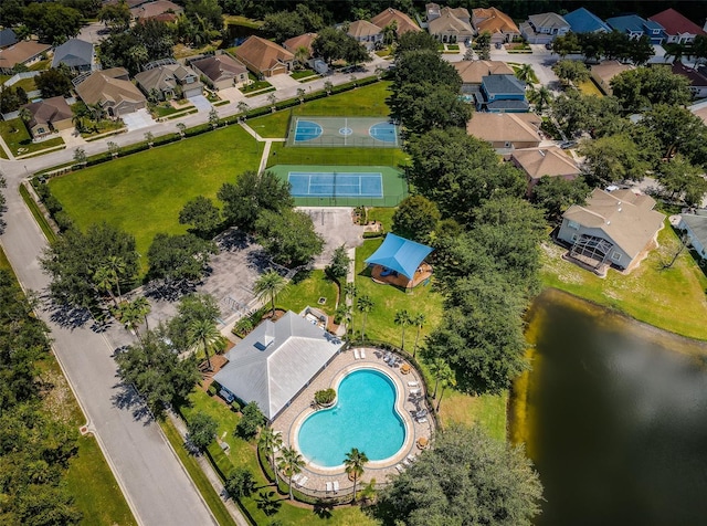 birds eye view of property with a water view