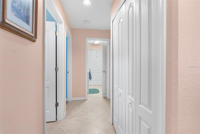 hallway with light tile patterned flooring