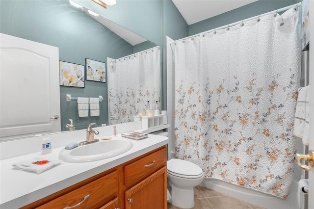 bathroom with tile patterned flooring, vanity, and toilet