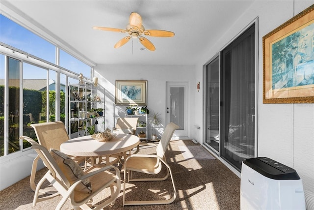 sunroom / solarium with ceiling fan