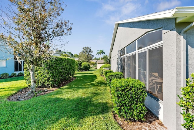 view of yard with a sunroom