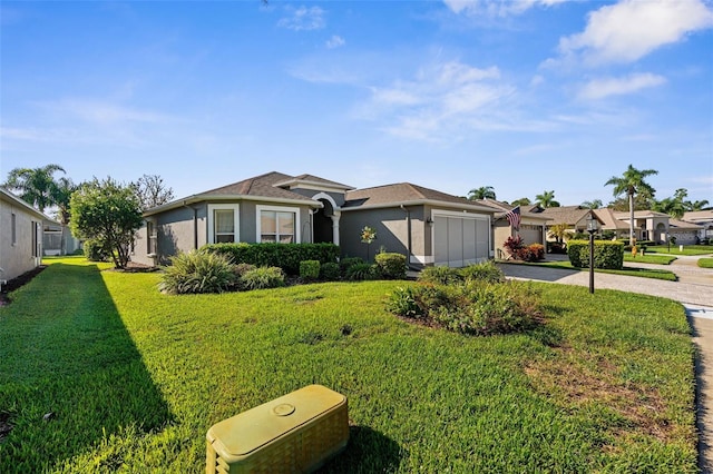 ranch-style house featuring a front lawn and a garage