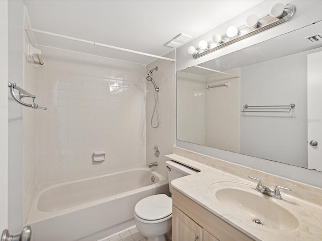 full bathroom featuring tiled shower / bath combo, tile patterned floors, vanity, and toilet