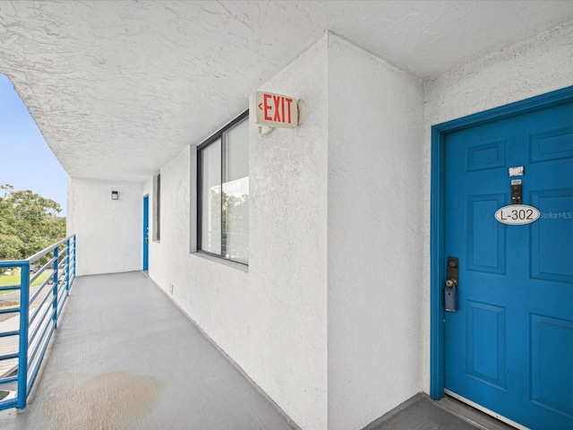 doorway to property with a balcony