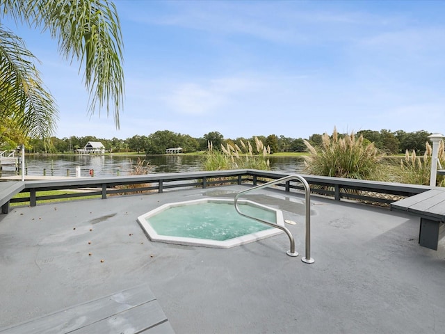 view of pool featuring a water view