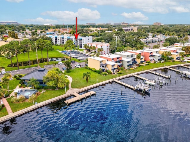 birds eye view of property with a water view