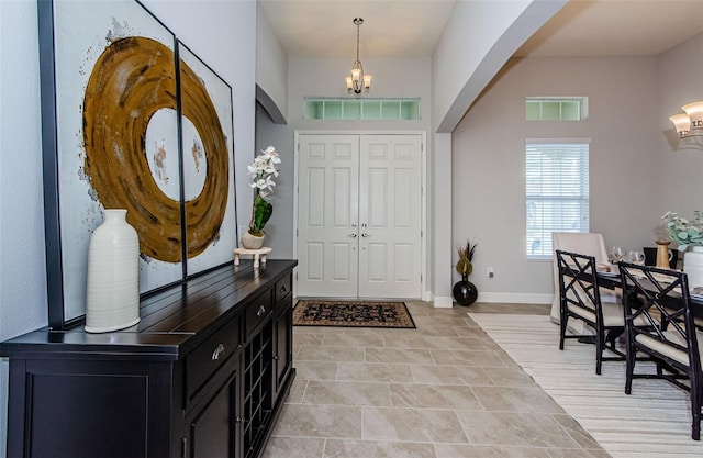 foyer with a notable chandelier