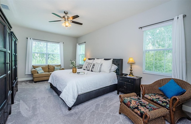 carpeted bedroom with ceiling fan