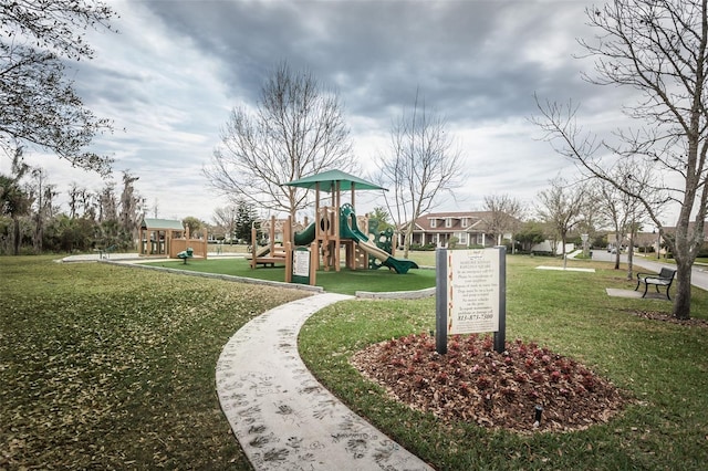 view of community featuring a yard and a playground