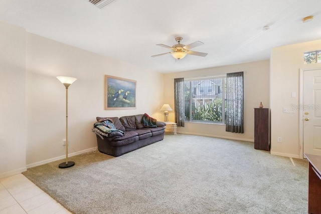 living room featuring ceiling fan and light colored carpet