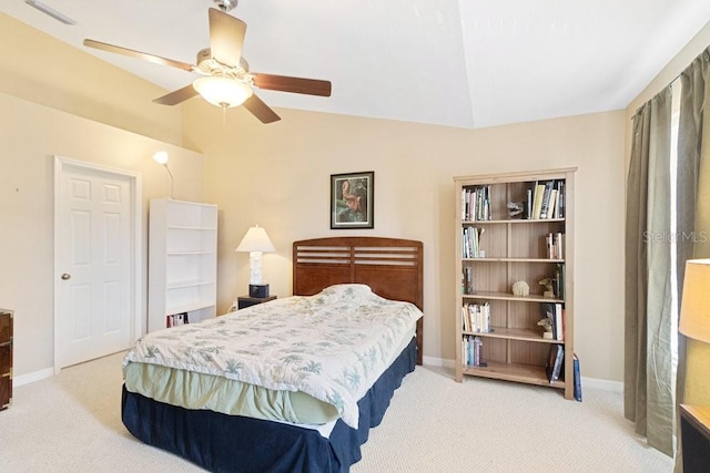 bedroom featuring lofted ceiling, light carpet, and ceiling fan