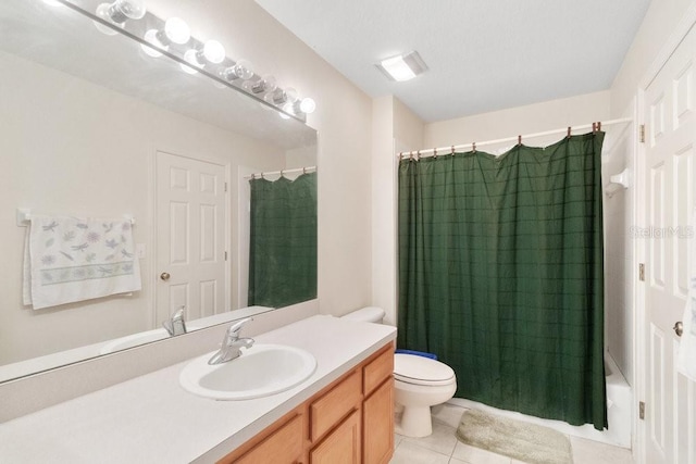 full bathroom featuring shower / bath combo, tile patterned flooring, vanity, and toilet