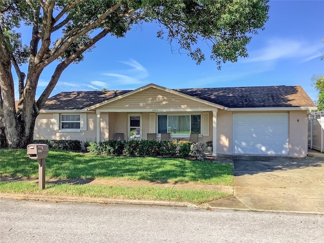 ranch-style house with a front lawn and a garage