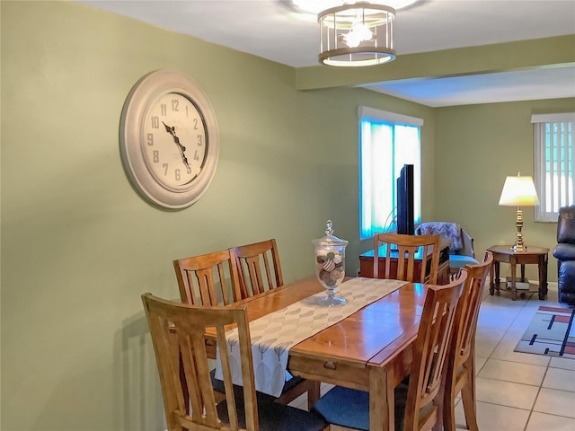 tiled dining room with a wealth of natural light