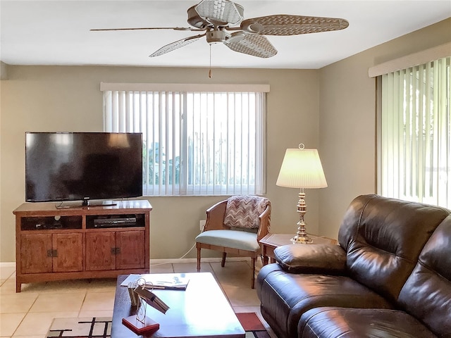 living room featuring ceiling fan, plenty of natural light, and light tile patterned floors