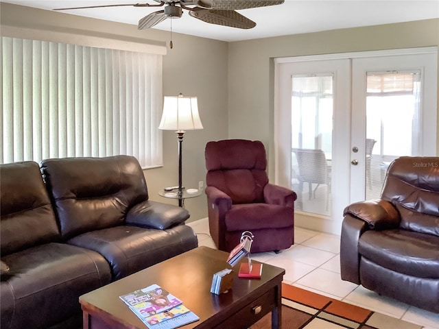 living room with french doors, light tile patterned flooring, and ceiling fan