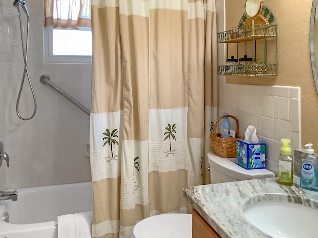 full bathroom featuring vanity, toilet, and shower / bath combination with curtain