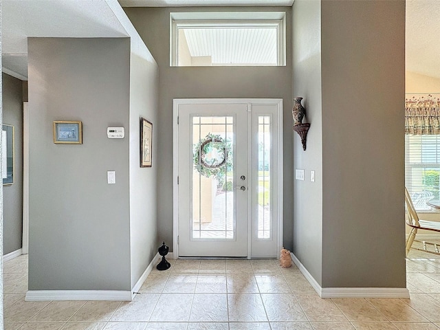 foyer featuring light tile patterned floors