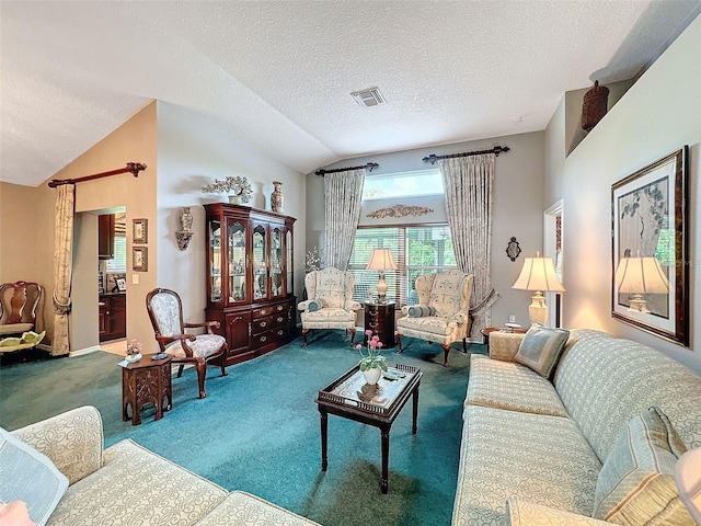 carpeted living room with lofted ceiling and a textured ceiling