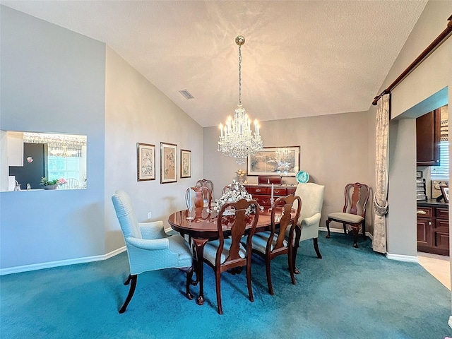 dining area featuring light colored carpet, plenty of natural light, and vaulted ceiling