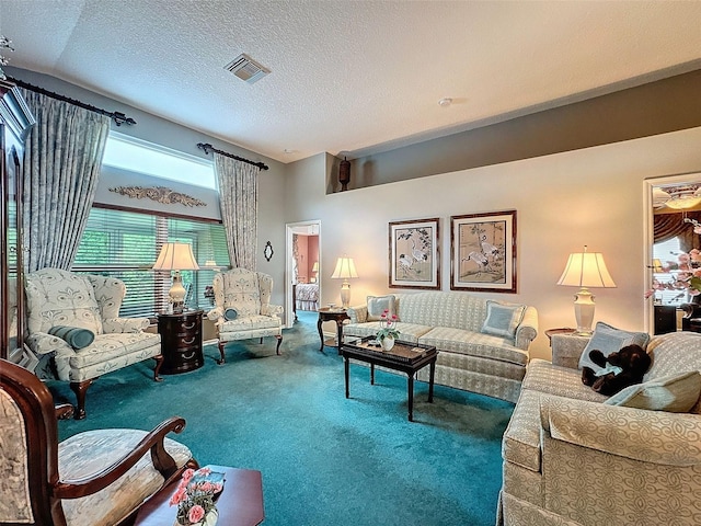 carpeted living room featuring a textured ceiling