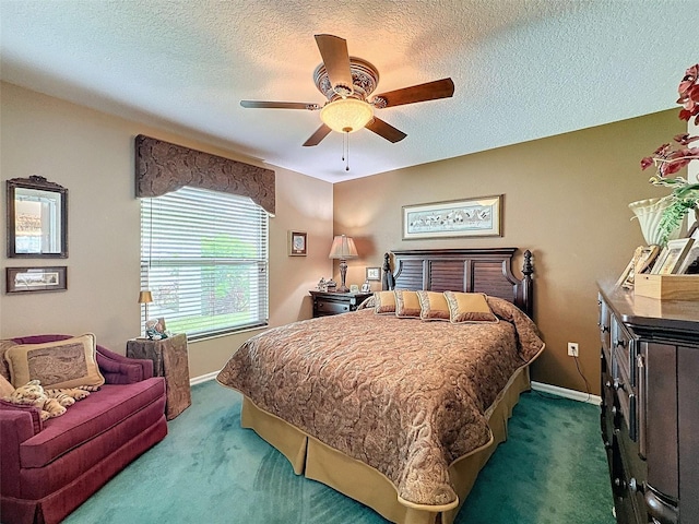 bedroom featuring ceiling fan, a textured ceiling, and dark colored carpet