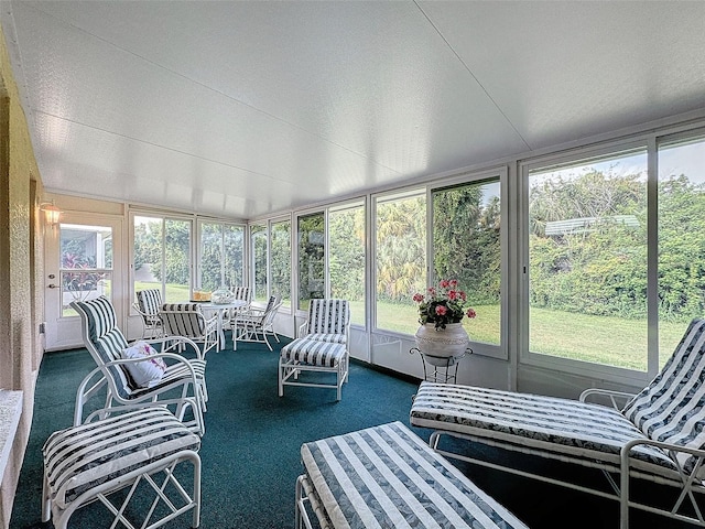 sunroom / solarium featuring plenty of natural light