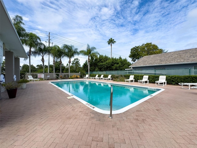 view of swimming pool featuring a patio area