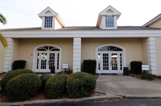 property entrance featuring french doors